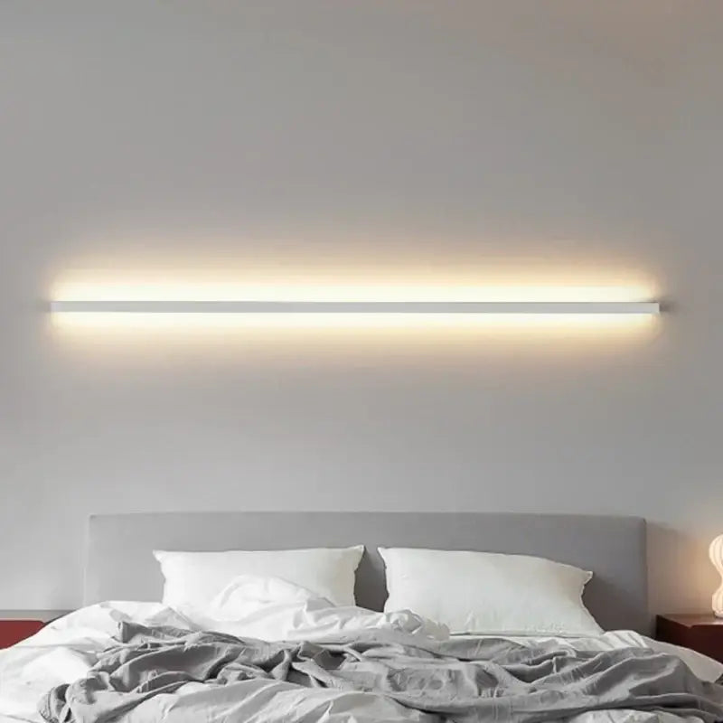 A sleek modern white decorbites led wall sconce with slim rectangular design and warm light for wall lights dimming