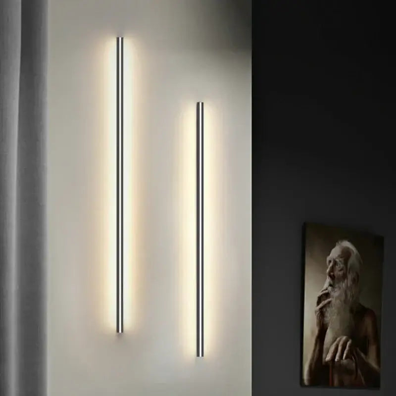 Two modern black decorbites led wall lights with minimalist linear design emit warm light with wall lights dimming feature