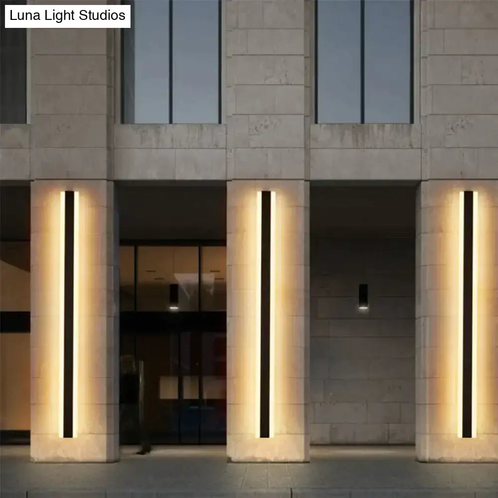 Decorbites™ modern minimalist vertical aluminium led wall mounted lamp with warm glow set into stone pillars for outdoor use