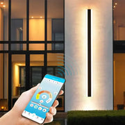 Modern black-framed aluminium decorbites outdoor waterproof led wall sconce emitting warm white light for garden use