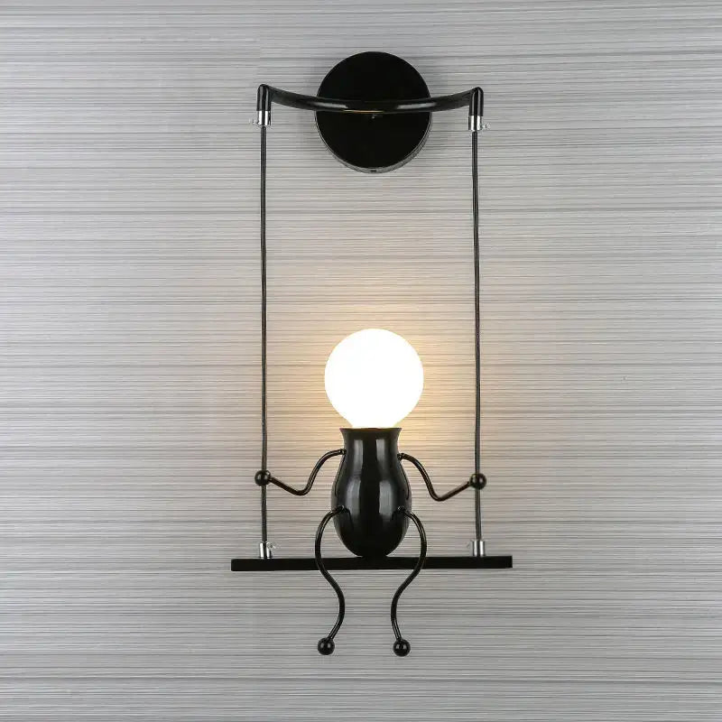 Modern black metal swing-style man led wall light with glowing head-shaped bulb for bedroom wall lighting