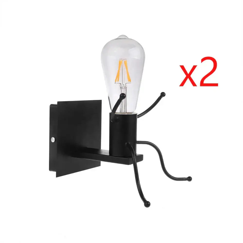 Modern black metal wall light with clear glass bulb and led filament design in a man led wall bedroom sconce