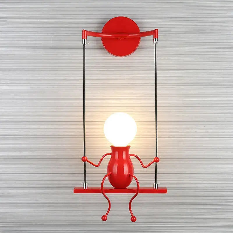 Red metallic swing-style wall light featuring a glowing bulb head in the modern black little man led wall light design