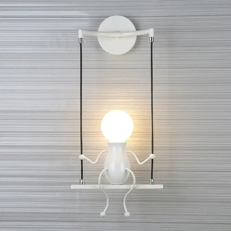 Modern black little man led wall light with white ceramic swing-mounted articulated limbs for bedroom use