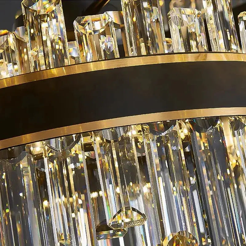 Modern black luxury crystal chandelier with cascading clear prisms and gold-toned frame for dining room decorbites light luxury