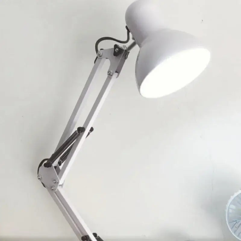 White adjustable swing arm desk lamp with sleek metallic finish ideal for modern office and bedroom use