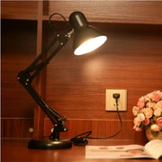 Modern black metal desk lamp with adjustable swing arm and illuminated shade for bedroom or office use