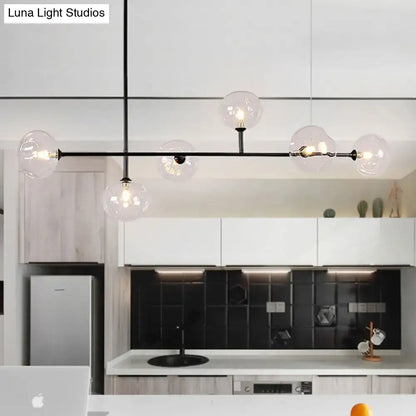 Modern black metal chandelier with clear glass globe bulbs and bulb base for stylish restaurant ambiance lighting