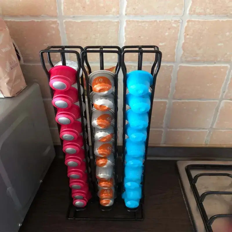 Modern black metal capsule holder stand with pink orange and blue coffee capsules for kitchen storage organization