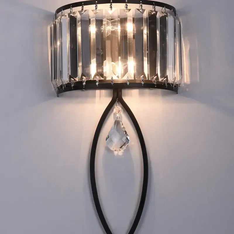 Modern black metal led wall lamp with vertical crystal rods and faceted crystal pendant for living room