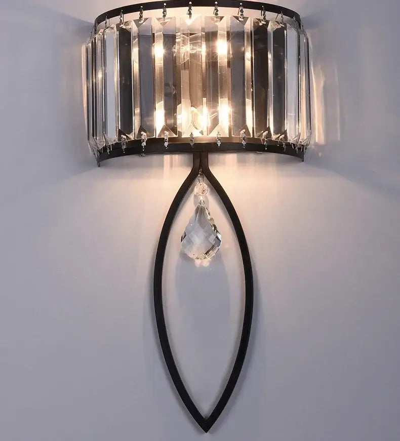 Modern black metal led wall lamp with vertical crystal rods and teardrop pendant for living room lighting