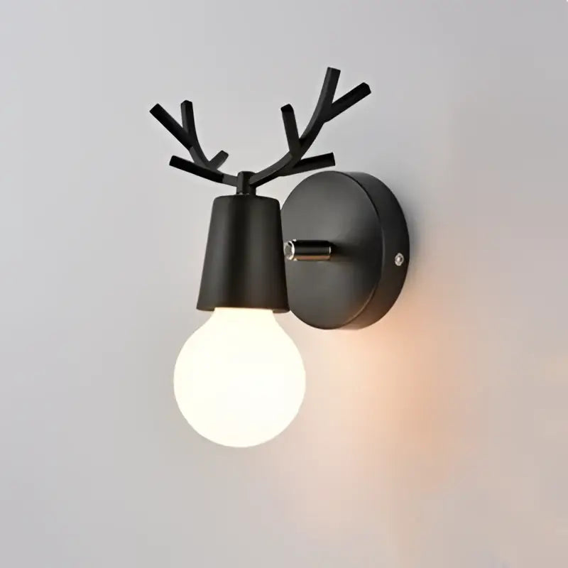 Modern black metal deer head led wall lamp with antler design and glowing bulb for bedroom sconce lighting