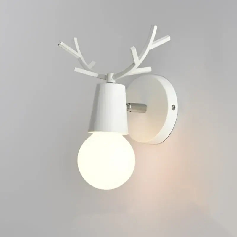 Modern black metal deer head led wall lamp featuring a white deer antler-themed sconce with frosted glass bulb