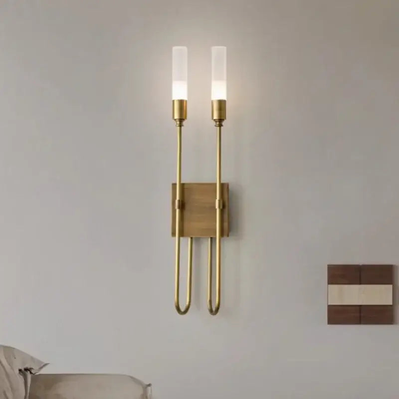 Modern black metal wall lamp with brass sconce and double headed led frosted glass bulbs on wooden backplate decorbites double headed