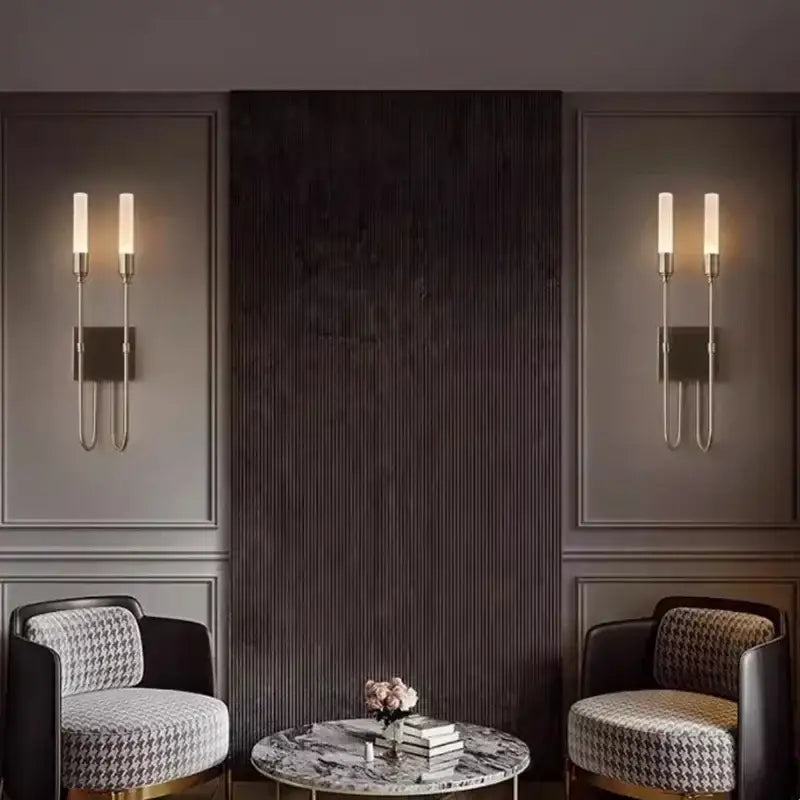 Modern black metal double headed led wall lamp with slender arms and warm glowing bulbs for bedroom decorbites double headed design