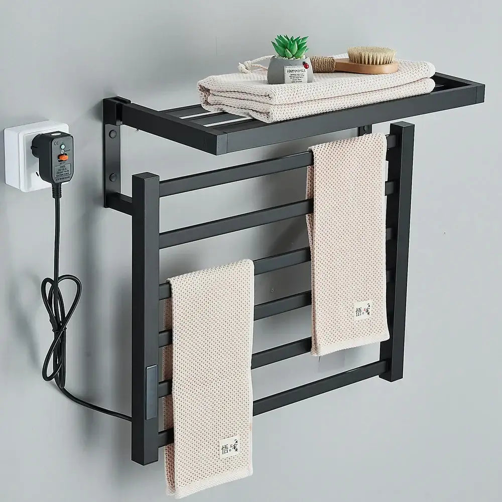 Modern black metal electric towel rack with integrated heating element and shelf for bathroom use