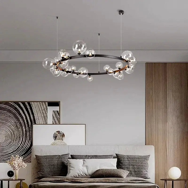 Modern black metal glass ball pendant chandelier with clear globe bulbs arranged in a circular pattern for dining room decorbites pendant chandelier