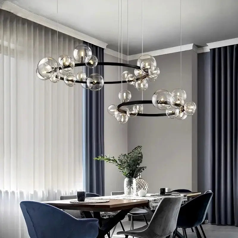 Modern black metal glass ball pendant chandelier with clear spheres in a circular design for dining room decorbites pendant chandelier