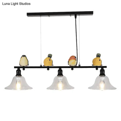 Modern black metal island pendant light with three clear glass shades and colorful bird figurines for 110v-120v use
