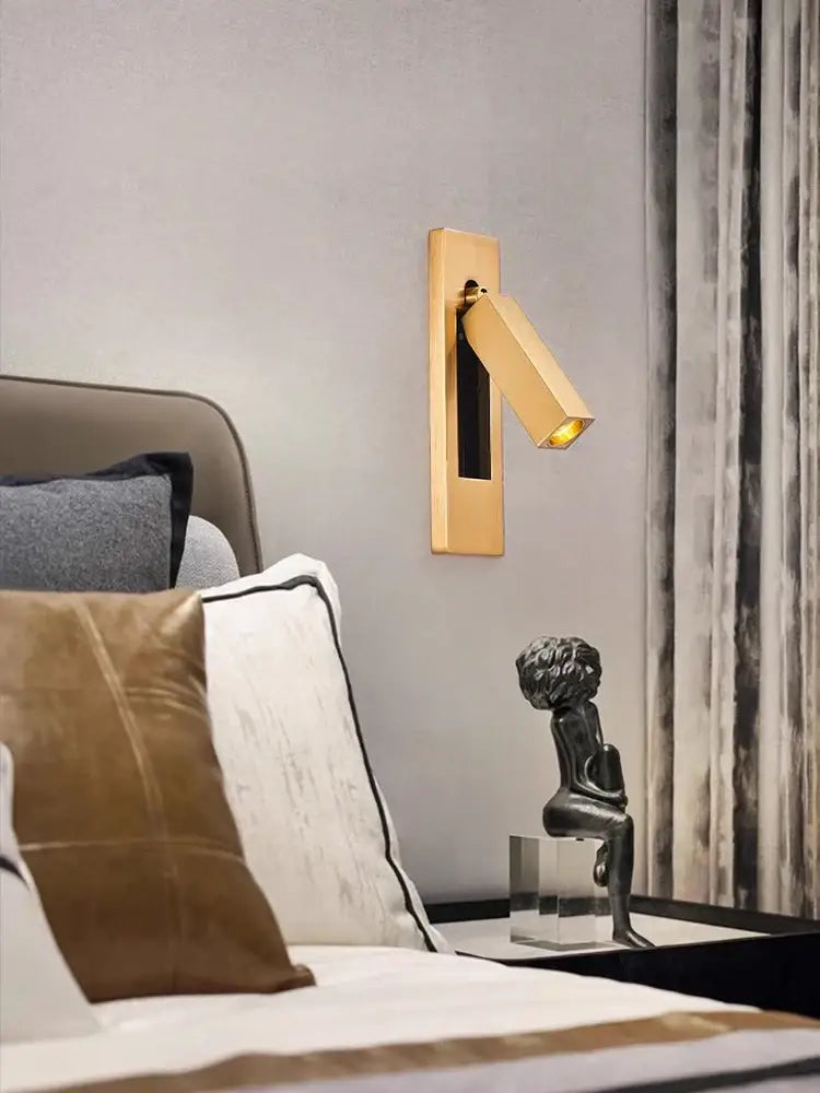 Gold-toned rectangular led wall lamp with sleek modern design and adjustable angled light for bedroom reading