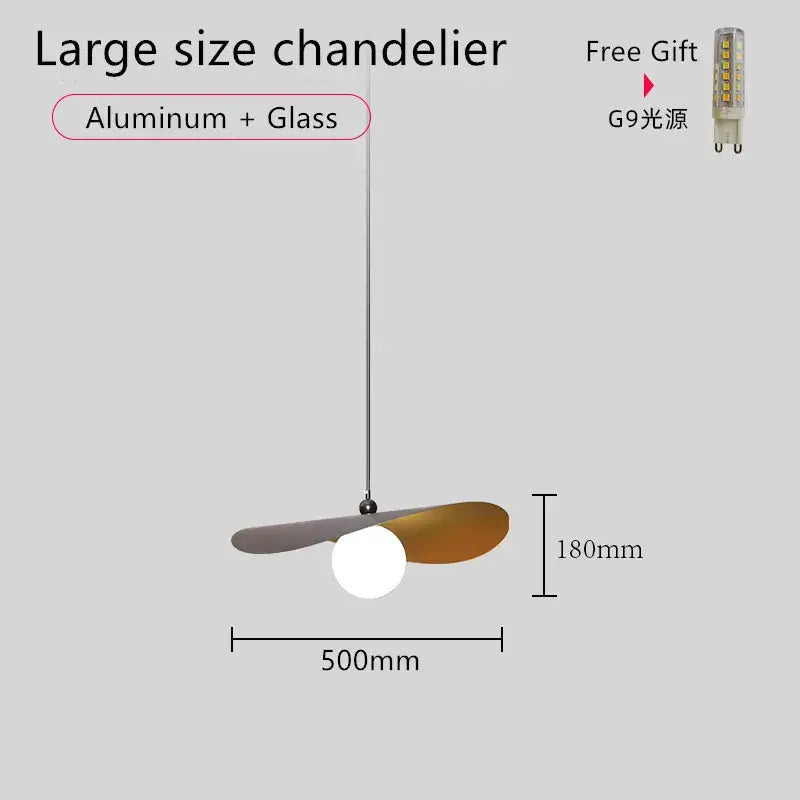 A modern large chandelier with aluminum and glass wings in matte gray and bronze surrounding a white bulb