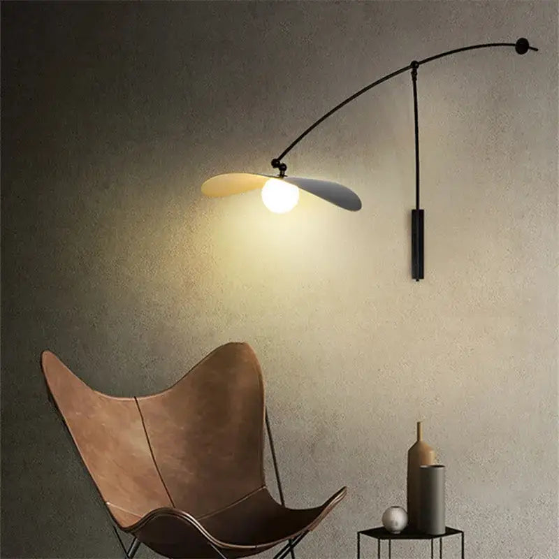 Modern black metal floor lamp with long arm and adjustable leaf-shaped shade ideal for living room decorbites design