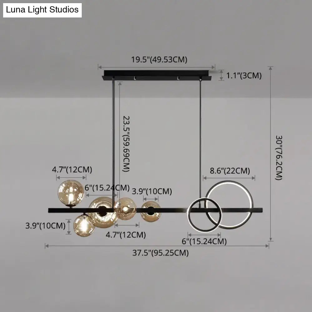 Modern black metal pendant light fixture with spherical glass globes and circular rings for dining room ceiling light
