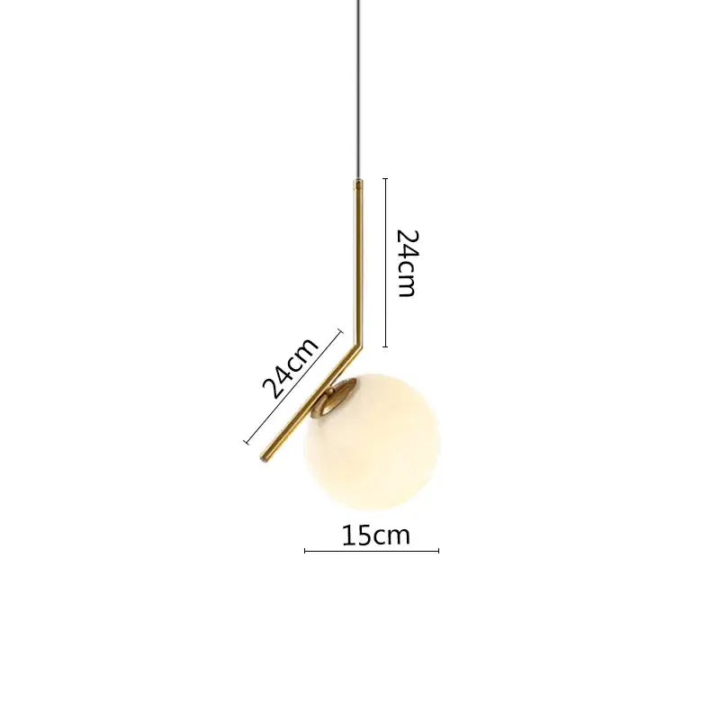 Minimalist pendant light with black metal ring, brass arm, and frosted glass globe for modern dining room decor