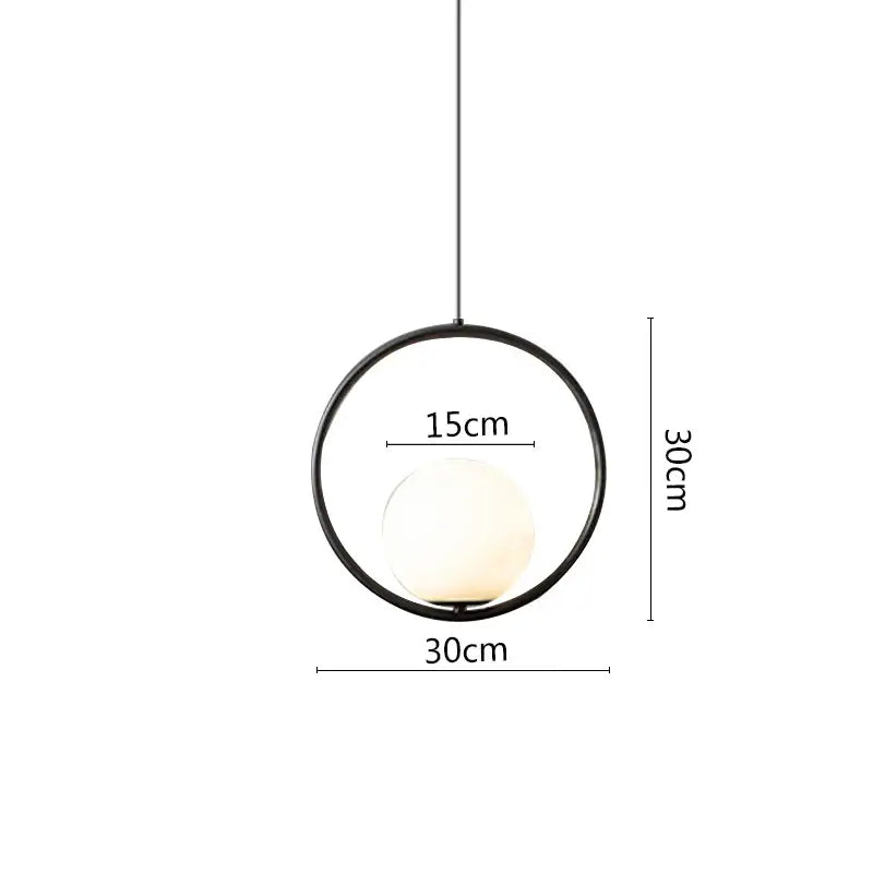 Minimalist pendant light with black metal ring and frosted glass globe for modern dining room illumination