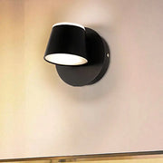 Modern black metal shade wall sconce with white interior and matte finish ideal for bedroom vanity fixture width and shade height