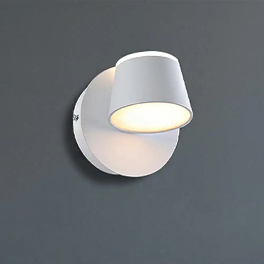 Modern white cylindrical wall sconce with metal shade, fixture width and shade height for bedroom vanity lighting