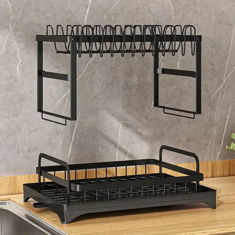 Modern black metal two tier dish drainer rack with upper wire looped holders and lower tray grid for kitchen organization