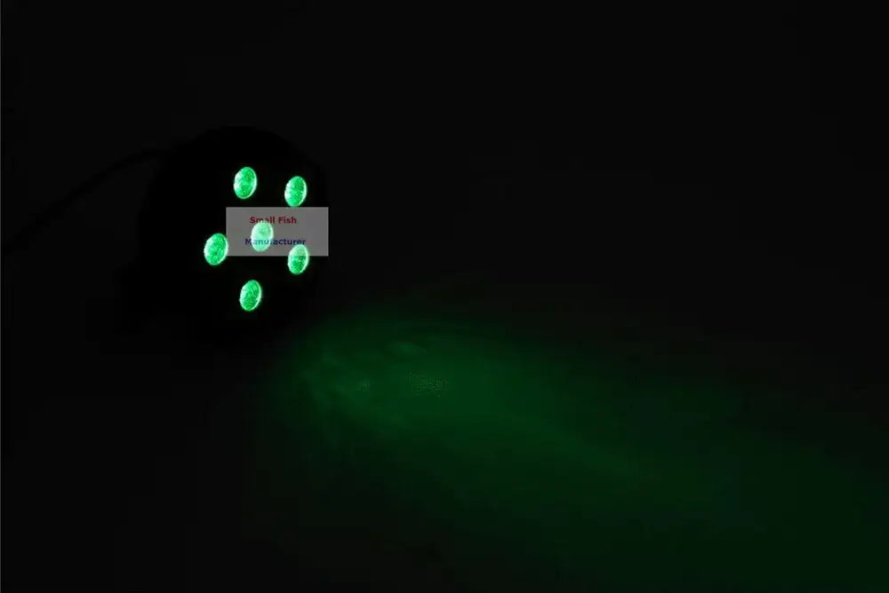 Modern black mini led flat par light with five green lights projecting a soft glow for party room sound activation