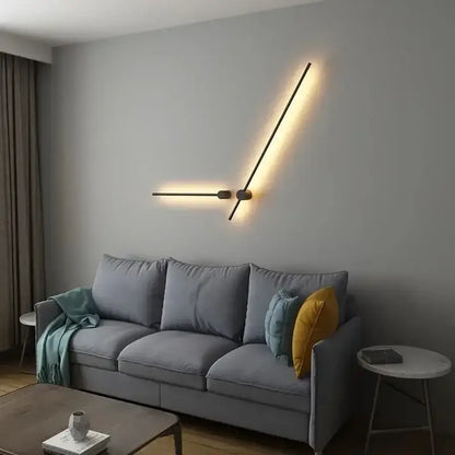 Modern black minimalist wall lamp with two angled arms emitting warm glow in decorbites led strip staircase light
