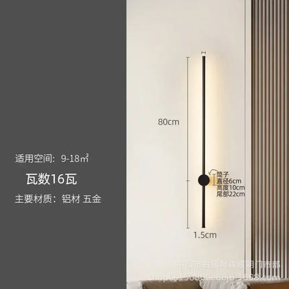 A sleek black wall lamp with slim cylindrical body and circular base for modern decorbites led strip lighting