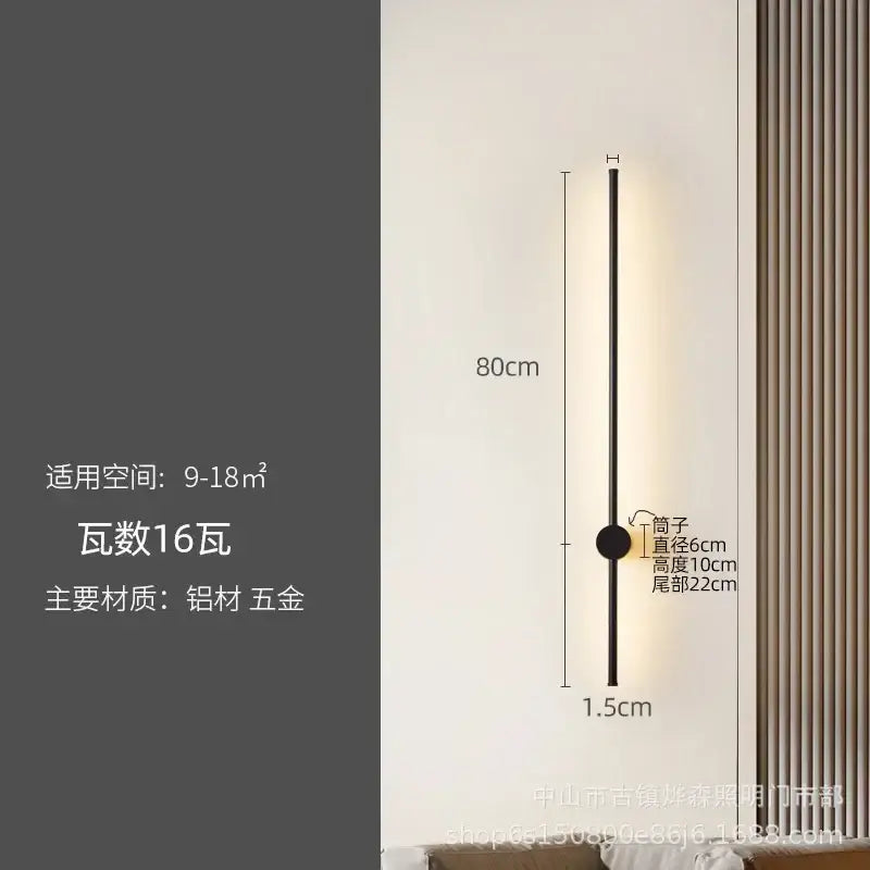 A sleek black wall lamp with slim cylindrical body and circular base for modern decorbites led strip lighting