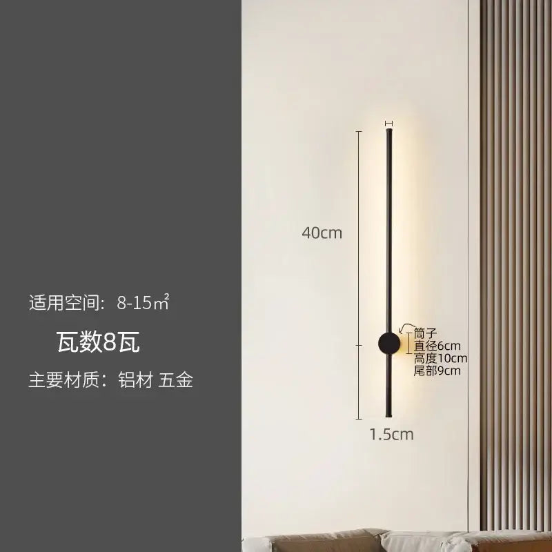 A sleek modern black wall lamp with a slim cylindrical design by decorbites led strip for staircase lighting