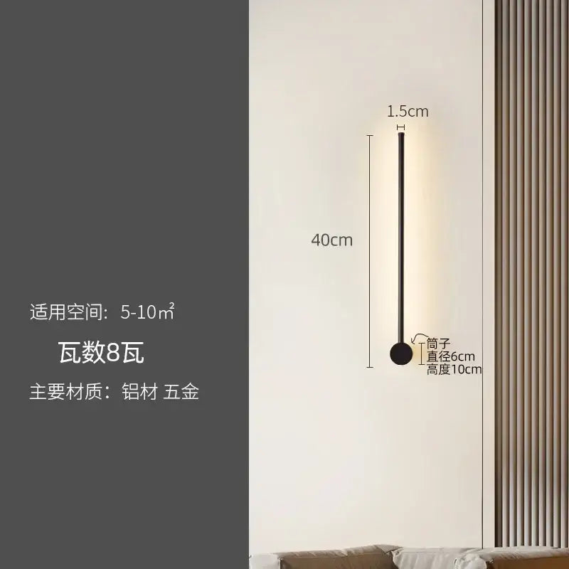 A sleek modern black wall lamp with a slim cylindrical body by decorbites led strip for staircase lighting