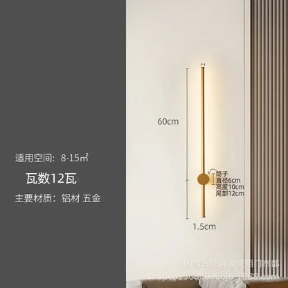 Gold-toned minimalist wall lamp with slender cylindrical body and circular accent for decorbites led strip lighting