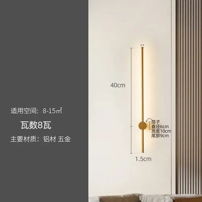 A sleek gold-toned wall lamp with a slender cylindrical body and circular base for decorbites led strip lighting