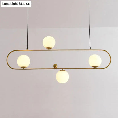 Modern black minimalist ellipse ceiling light with brass finish and four frosted glass globes for living room ceiling light