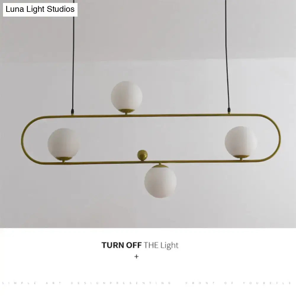 Modern black minimalist ellipse ceiling light with gold-toned metal frame and frosted white globes for living room