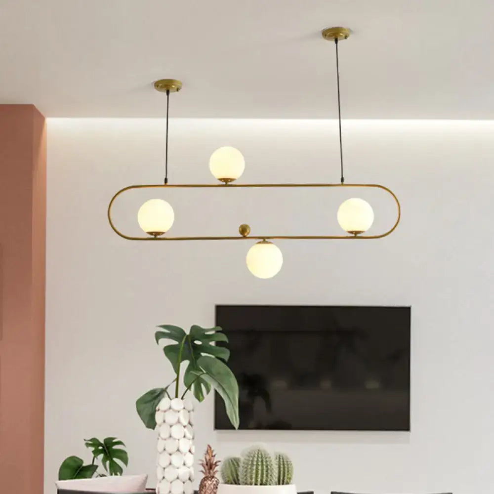 Modern black minimalist ellipse ceiling light with gold-toned frame and frosted white globes for living room lighting
