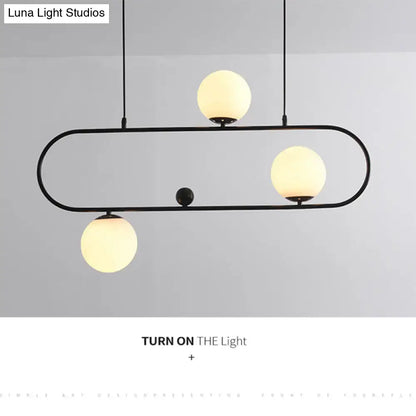 Modern black metal ceiling light with three warm glass globes minimalist ellipse design for living room use