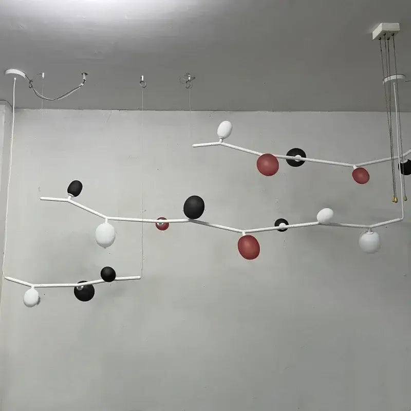 Modern black minimalist glass branch chandelier with white black and red spherical elements for dining room decorbites glass branch