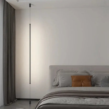 A sleek black led floor lamp with a minimalist cylindrical body and subtle lighting for modern living rooms