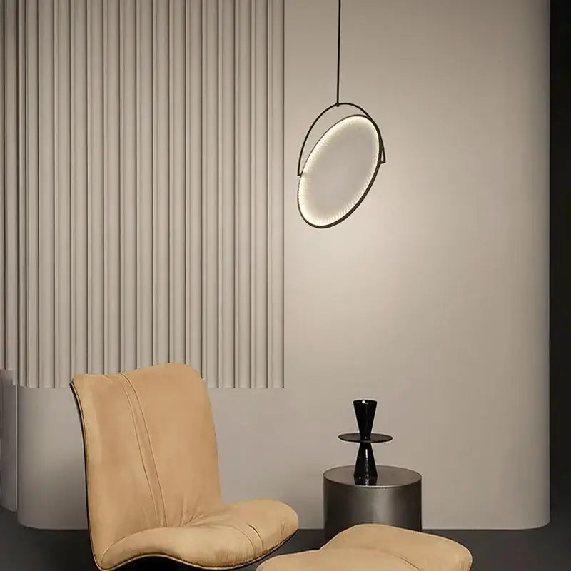 Modern black minimalist led pendant light with sleek circular frame and soft glowing illumination for living room