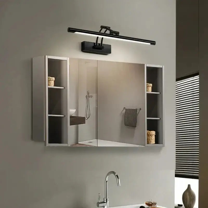 Modern black minimalist led wall lamp with sleek design mounted above mirrored medicine cabinet for bathroom vanity lighting