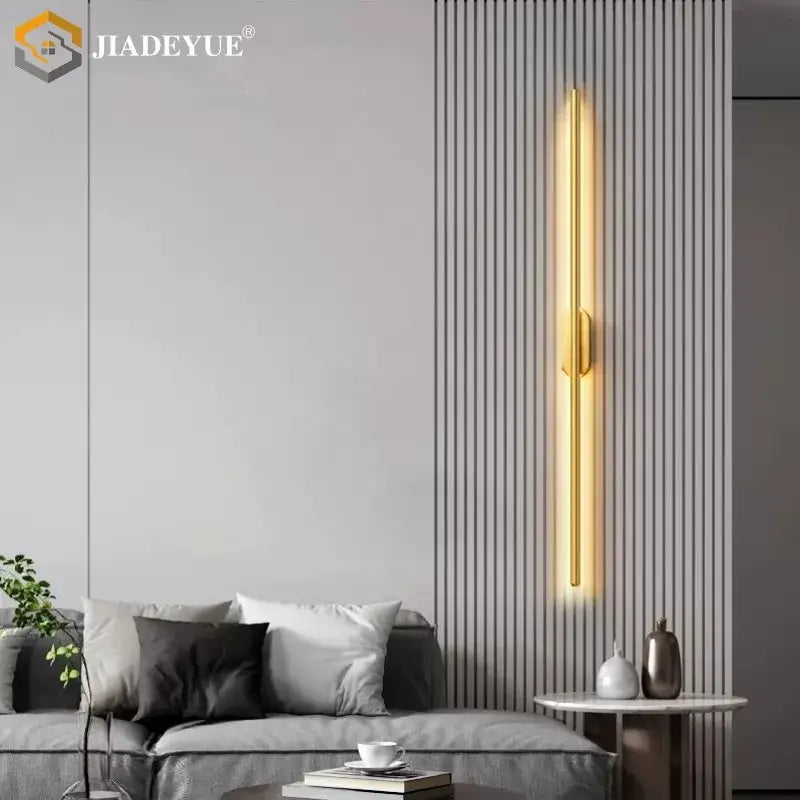 Gold-toned modern black minimalist led wall lamp with sleek rectangular design for warm ambient bedroom lighting decorbites wall lamp