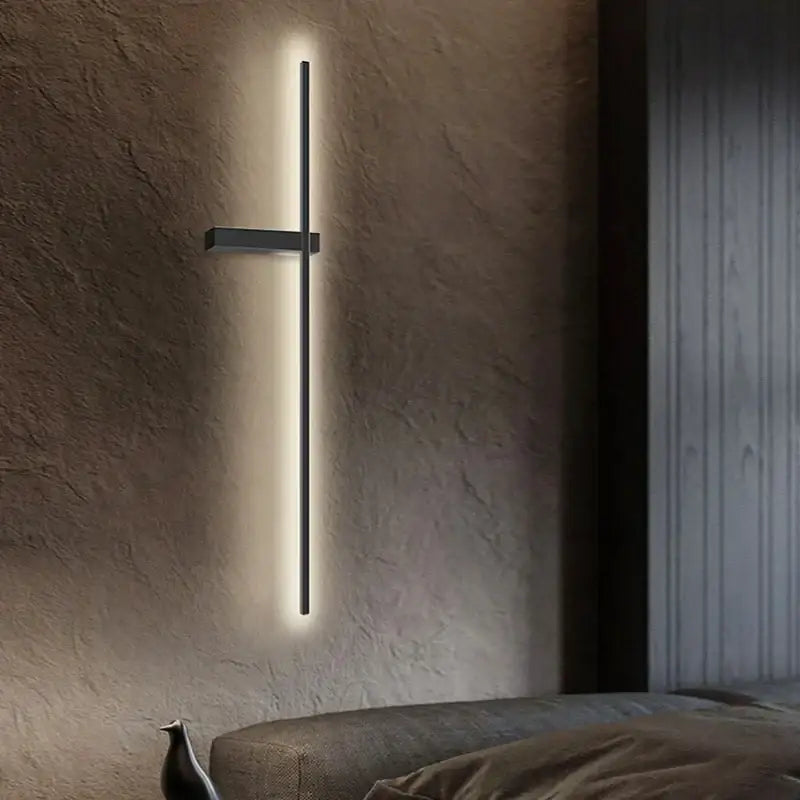 Modern black minimalist led wall lights by decorbites featuring a vertical sleek led strip and horizontal bracket for bedroom decor